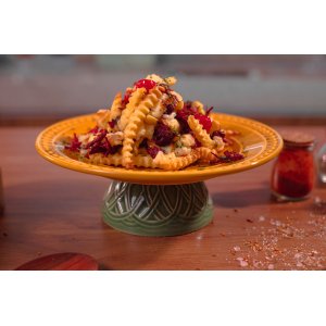 Batata na manteiga de garrafa com carne seca e queijo coalho